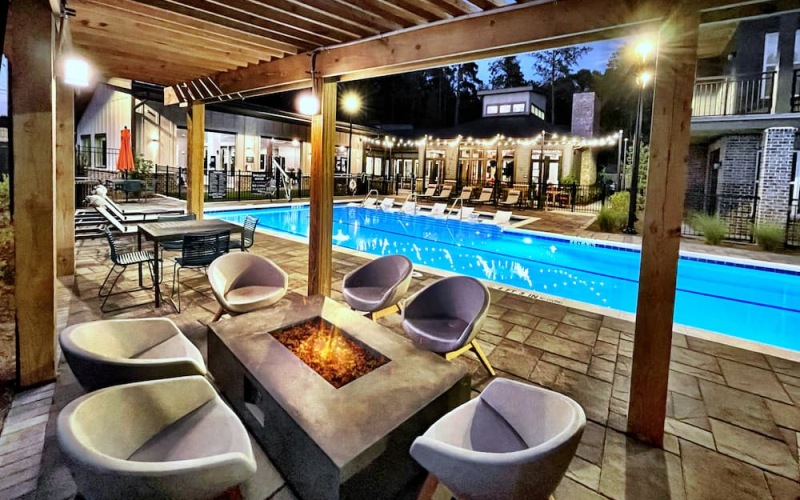 pool with nearness to property and ample shade from covering trees and with reclining seats
