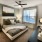 bedroom with a large window and modern decor