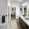 bathroom with a large mirror and ample lighting