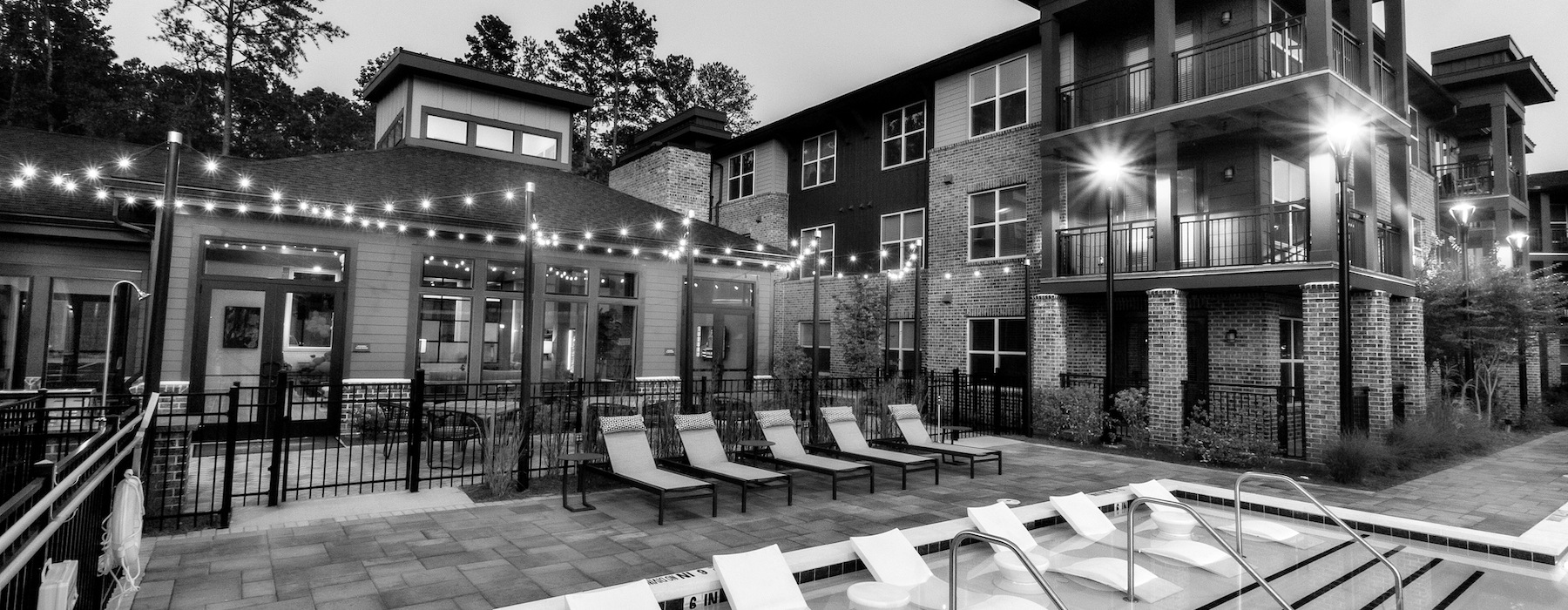 pool and lounge area in black and white